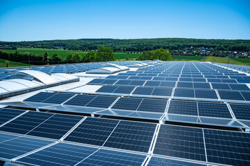 Large solar plant on an industrial hall generates renewable energy