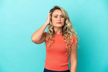 Young Brazilian woman isolated on blue background with an expression of frustration and not understanding