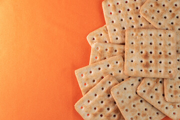 Salt crackers on the orange background