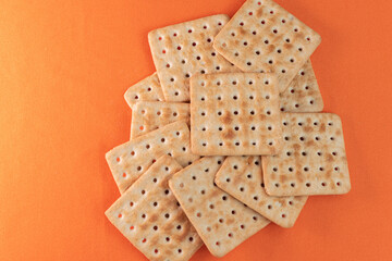 Salt crackers on the orange background