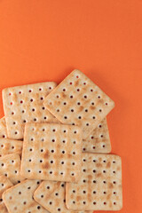 Salt crackers on the orange background
