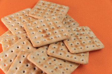 Salt crackers on the orange background