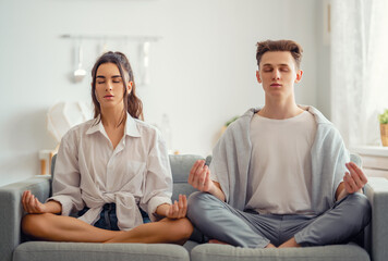 Fototapeta na wymiar couple meditating at home