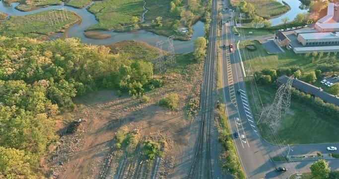 Aerial top view the locomotive on rails near road the platforms of the railway hub tracks positioned parallel