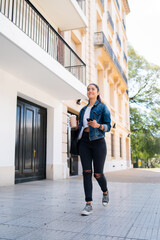 Young woman using her mobile phone.