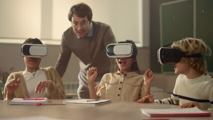 Male teacher and students in vr glasses learning cyber space in classroom - Powered by Adobe