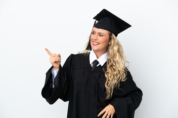 Young university graduate woman isolated on white background pointing finger to the side and presenting a product