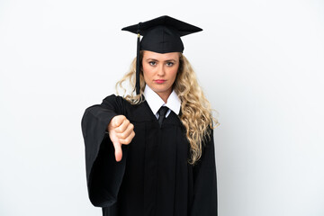 Young university graduate woman isolated on white background showing thumb down with negative expression