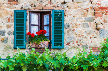 Fototapeta na wymiar Old Italian window on a medieval building