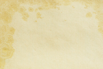 Old yellowed paper background texture with stain