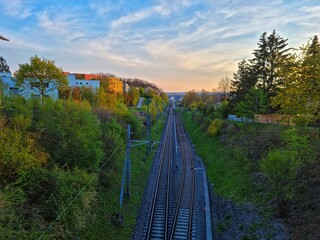 Obraz premium Nice sunset view from hill of train tracks