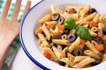 Sicilian pasta with tomato and black olives.