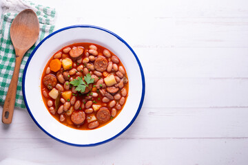 Beans with chorizo. Traditional tapa from the north of Spain in the Asturias region.