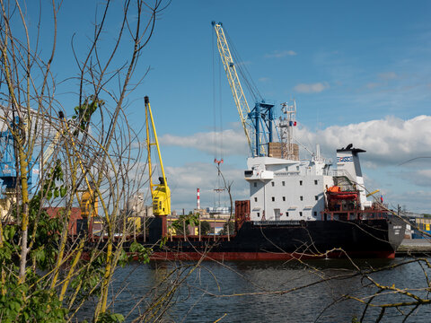Caen, France May 2021. Unloading of a ship under the Russian flag Mekhanik Brilin, French port of unloading on the Canal de Caen. 4k high definition movie