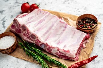 raw pork ribs on a stone background