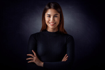 Obraz premium Studio portrait of beautiful young woman standing at isolated background