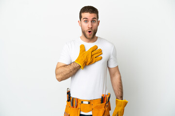 Young electrician man over isolated white wall surprised and shocked while looking right
