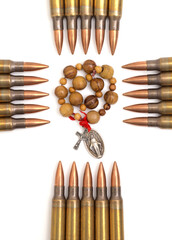 Rosary surrounded by bullets religious persecution concept. - obrazy, fototapety, plakaty