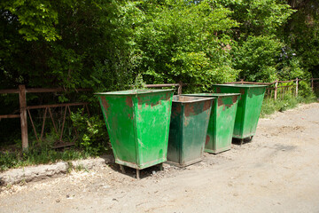 Trash bins on the street waiting to be collected