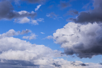 Obraz premium Dramatic thunderstorm clouds background at blue sky