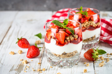 Greek yogurt with fresh strawberry and granola. Parfait.
