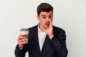 Young business caucasian man wearing wireless headphones and holding take way coffee isolated on white background is saying a secret hot braking news and looking aside