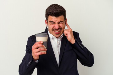 Young business caucasian man wearing wireless headphones and holding take way coffee isolated on white background covering ears with hands.