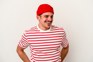 Young caucasian man isolated on white background happy, smiling and cheerful.