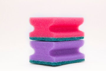 Pink and 
purple sponges for washing dishes isolated