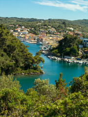 Yachts and boats in paxos harbour on the ionian greek island holiday resort.