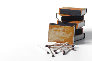 Bright brown cardboard boxes with matches. Matches scattered on a white background of kopi space