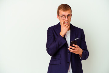 Young business man holding a phone isolated on white background