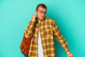 Young caucasian student man isolated on blue background