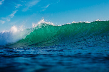 Ideal breaking wave in sea. Turquoise wave sunny day