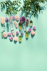 gemstones minerals set and leaves on green background. Healing stones for Crystal Ritual, Esoteric spiritual practice. modern wicca magic. flat lay. copy space