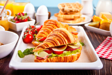 Croissant sandwiches with ham and cheese Breakfast concept.