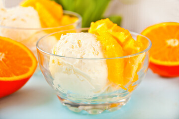 Homemade fresh orange ice cream with orange slices. Summer dessert.