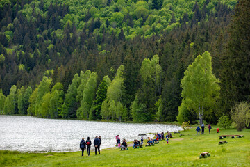 Fototapeta premium landscape with tourists on the shore of Lake Sfanta Ana - Romania