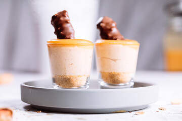 Peanut and caramel dessert shots with hazelnut and mascarpone cream