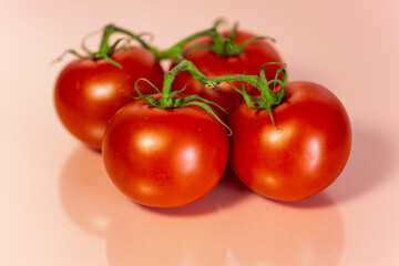 tomatoes on pink background