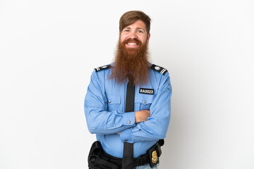 Fototapeta premium Redhead police man isolated on white background keeping the arms crossed in frontal position