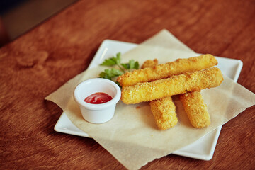 delicious fries with spicy sauce and green parsley for lunch 