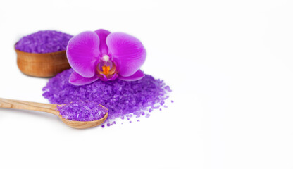Fototapeta na wymiar Sea salt and orchid on white background. Spa treatments.Body care concept. Close-up. Place for text.