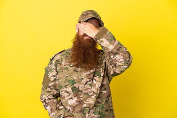 Military Redhead man over isolated on yellow background covering eyes by hands. Do not want to see...