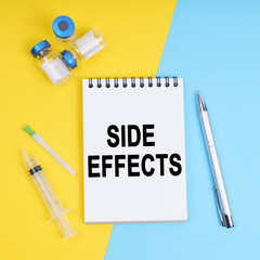A syringe, ampoules and a notebook with the inscription - Side effects