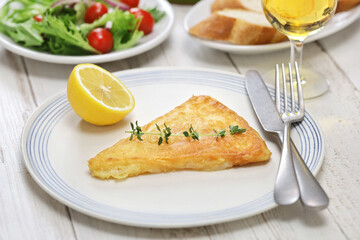 saganaki, Greek fried cheese is one of most popular mezzes in Greek tavernas