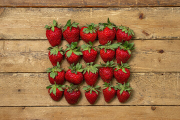 Strawberries on a wooden table. Ripe fresh strawberries. Healthy diet.