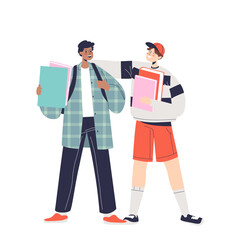 Two boy stand together and talk. School friends, teen schoolboys with backpacks and books