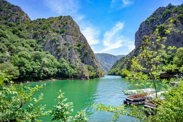 Fototapeta na wymiar Canyon Matka in North Macedonia beautiful view with rocks, lake, trees and colorful background