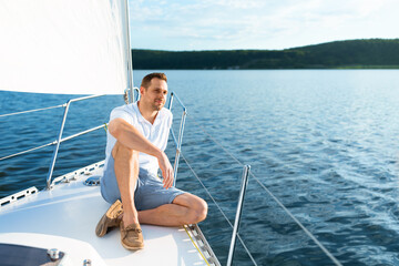 Happy Man Sitting On Yacht Deck Enjoying Sea Ride